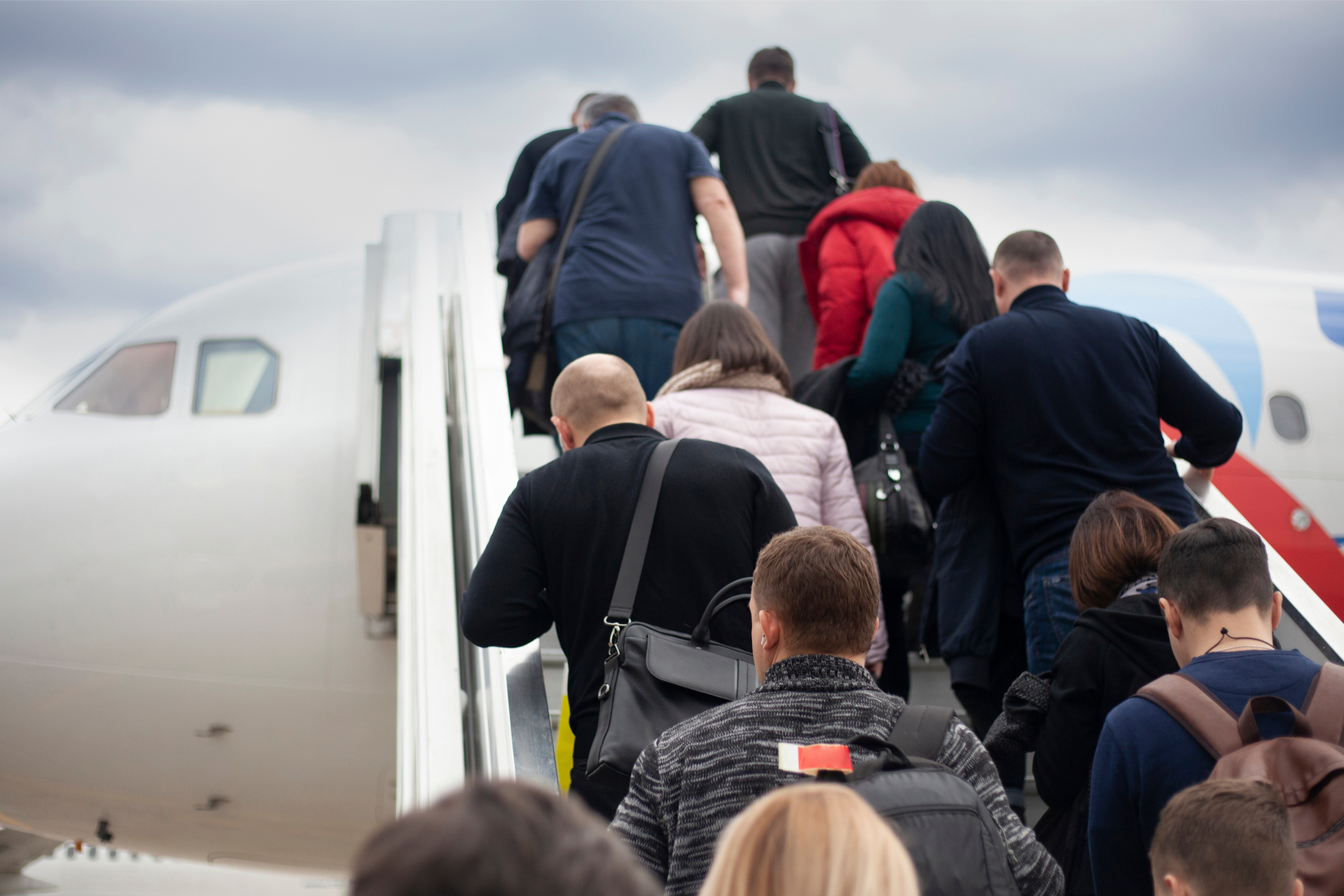 Travelers boarding a plane.