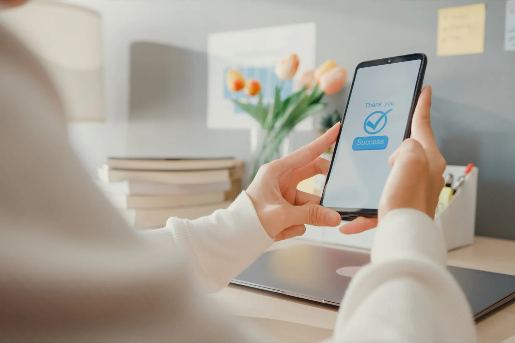 A woman using her phone for online banking.