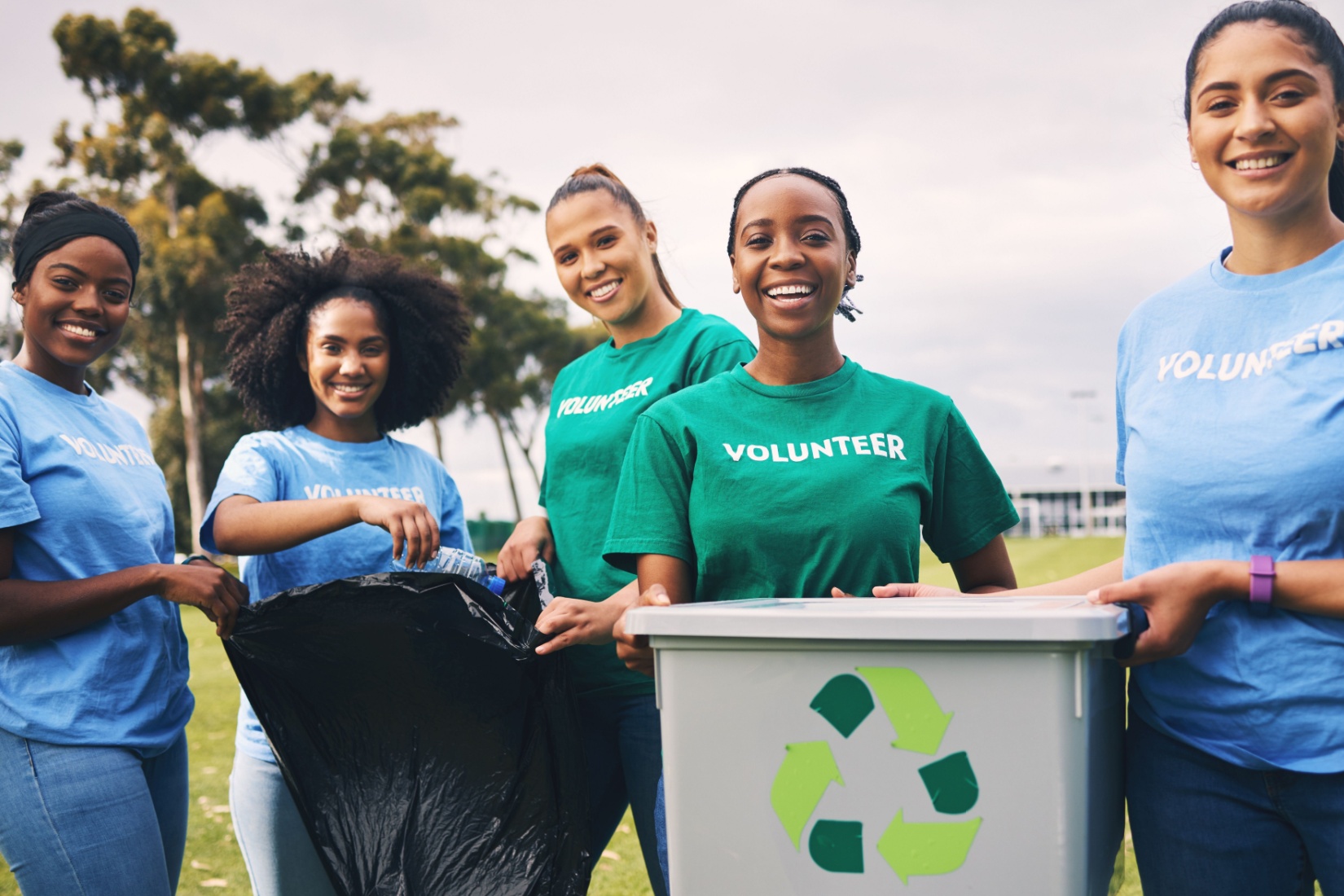 A group of women volunteering outside.