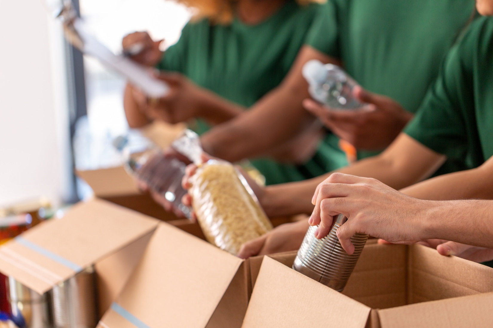 Food bank volunteers packing boxes.