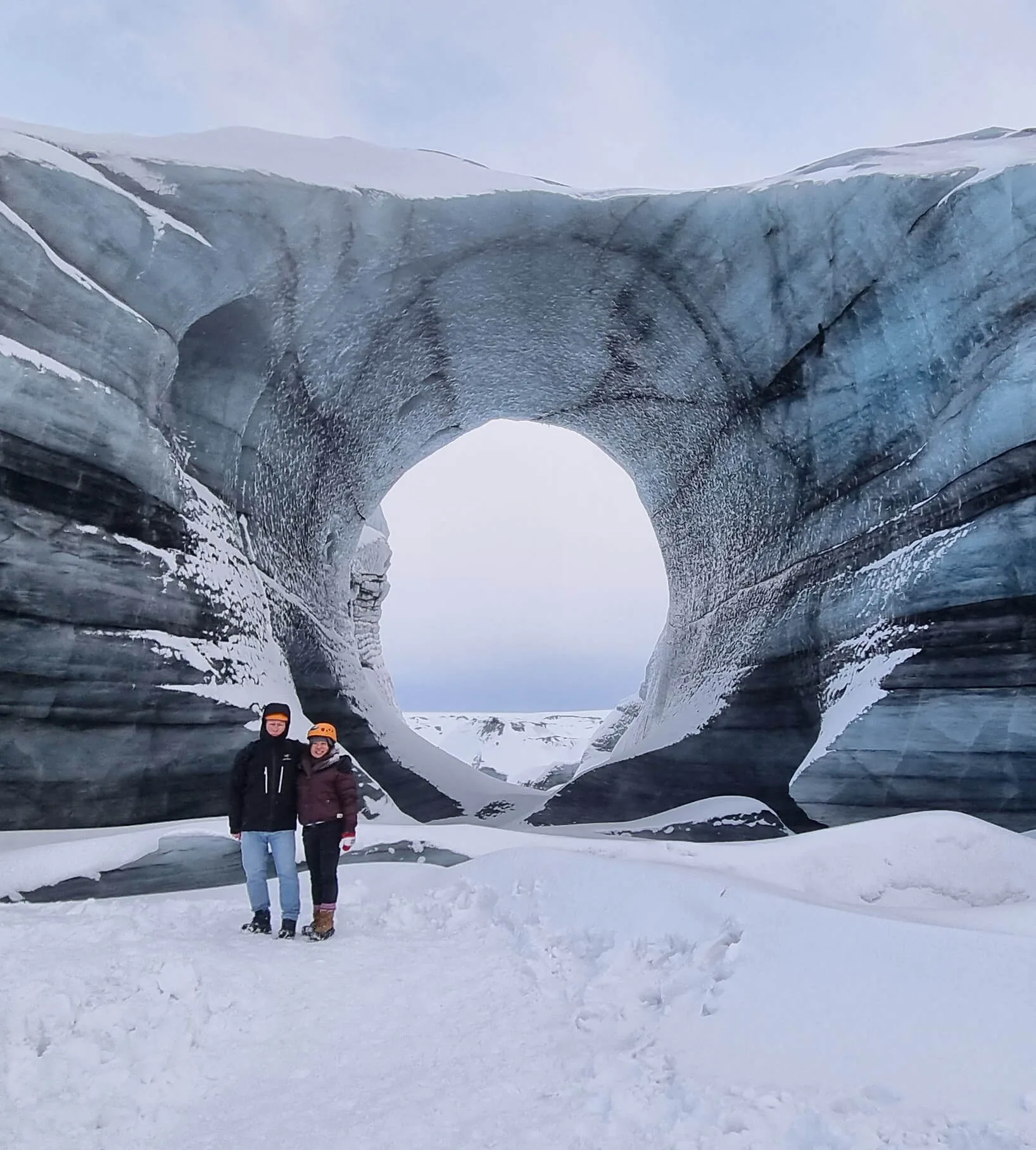 Couple next to icy rocks