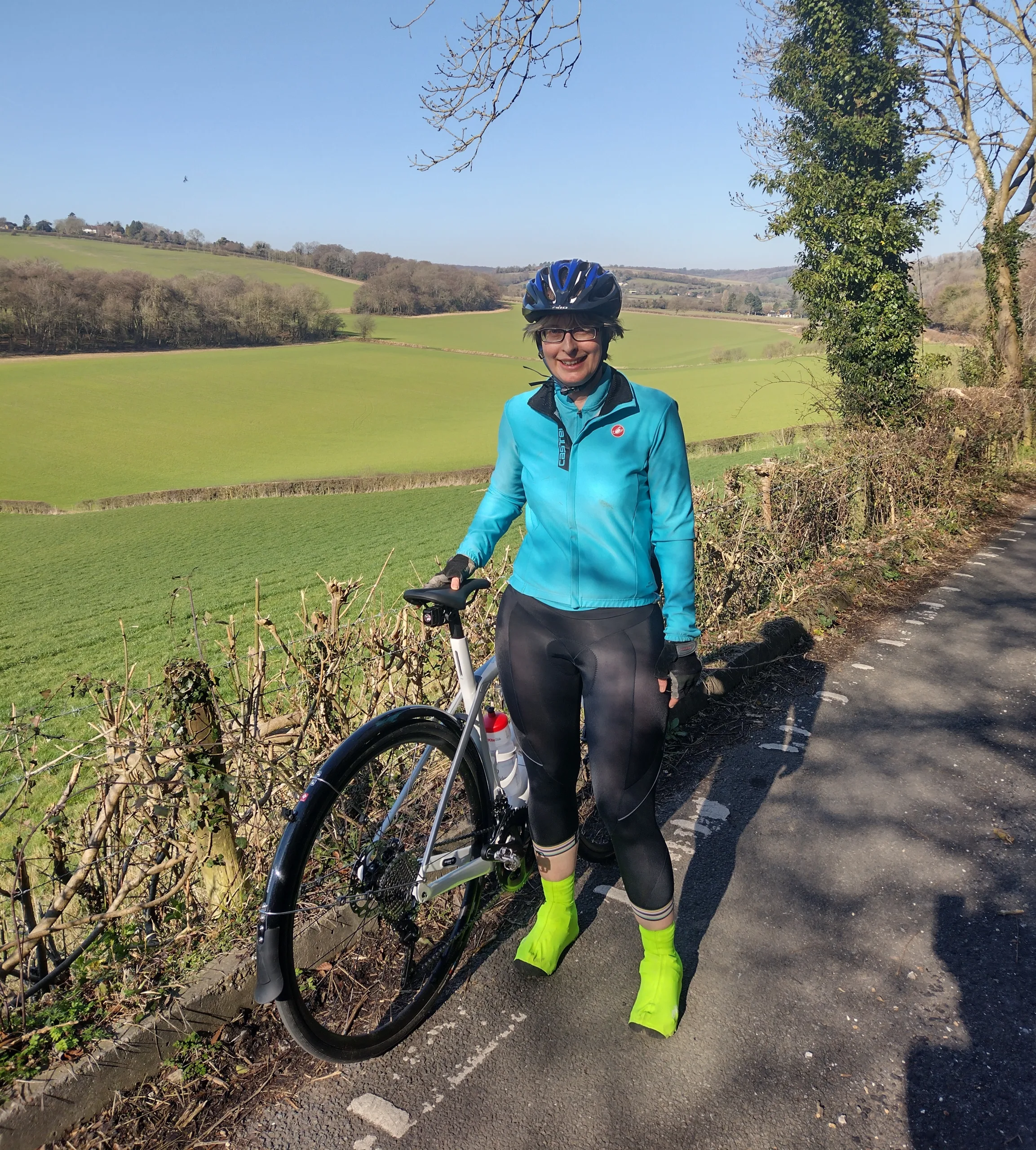 Woman standing by a bicycle