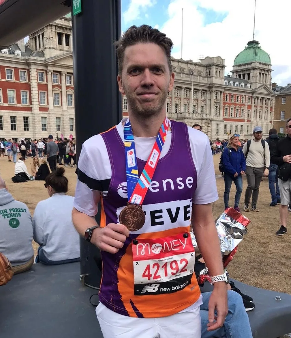 Man holding a medal