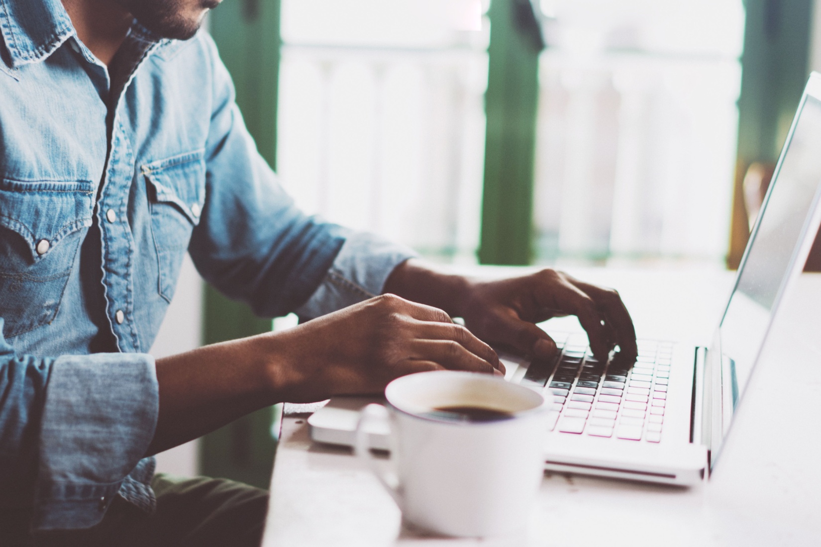 A man working from home on a laptop.