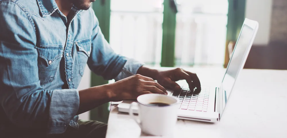 A man working from home on a laptop